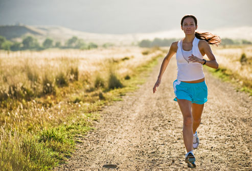 getty_rm_photo_of_woman_running_on_country_road.jpg